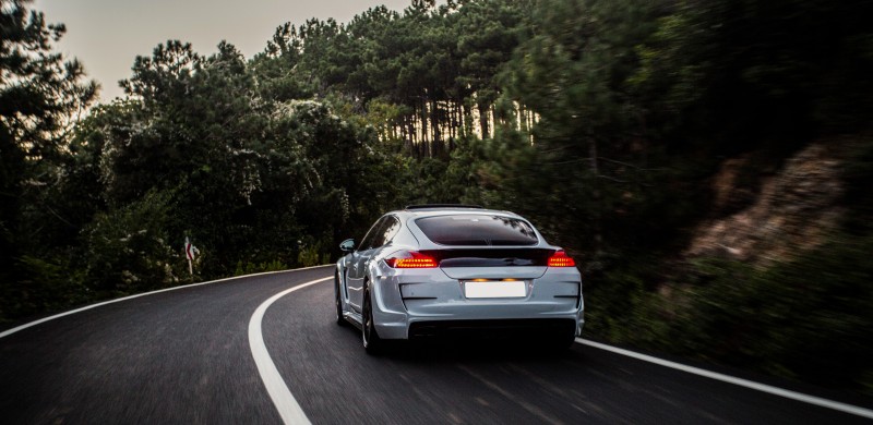 sport-car-with-black-white-autotuning-driving-forest (1)